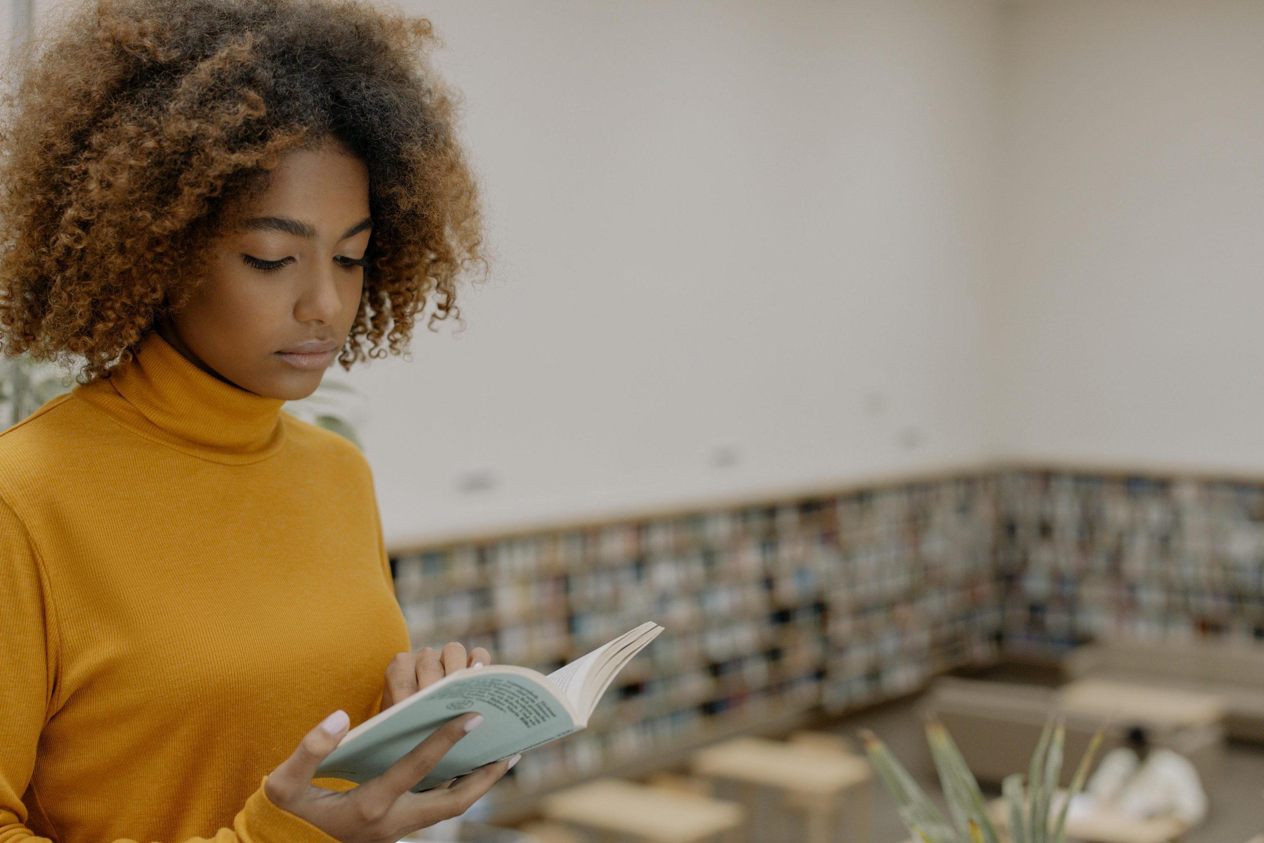 African woman reading a book
